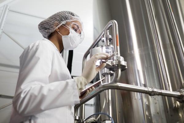 Pharmaceutical worker setting up equipment