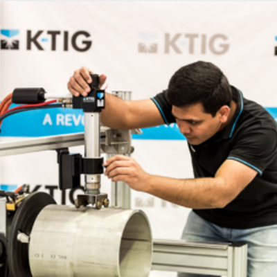 Man setting up the K-TIG torch for welding