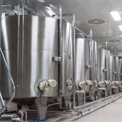 Line of beverage containers inside a cool chamber