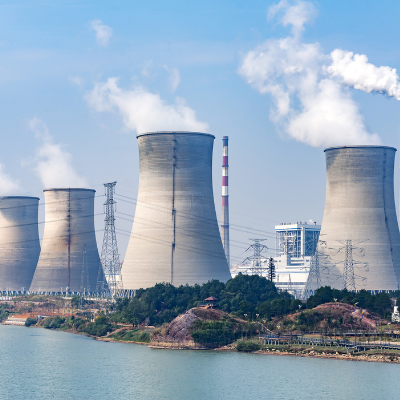 Four cooling towers in front of nuclear power station Four cooling towers in front of nuclear power station