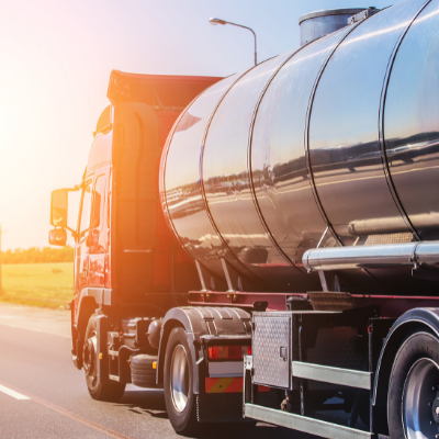 Tanker truck driving into the sunset